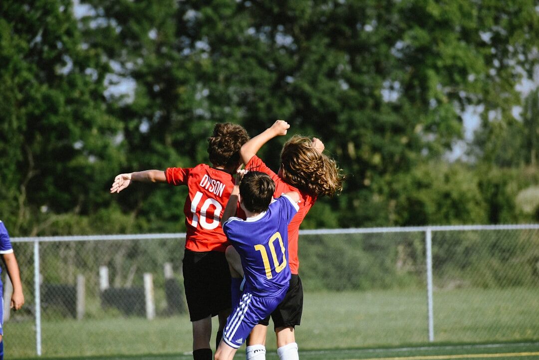 soccer players celebrating victory