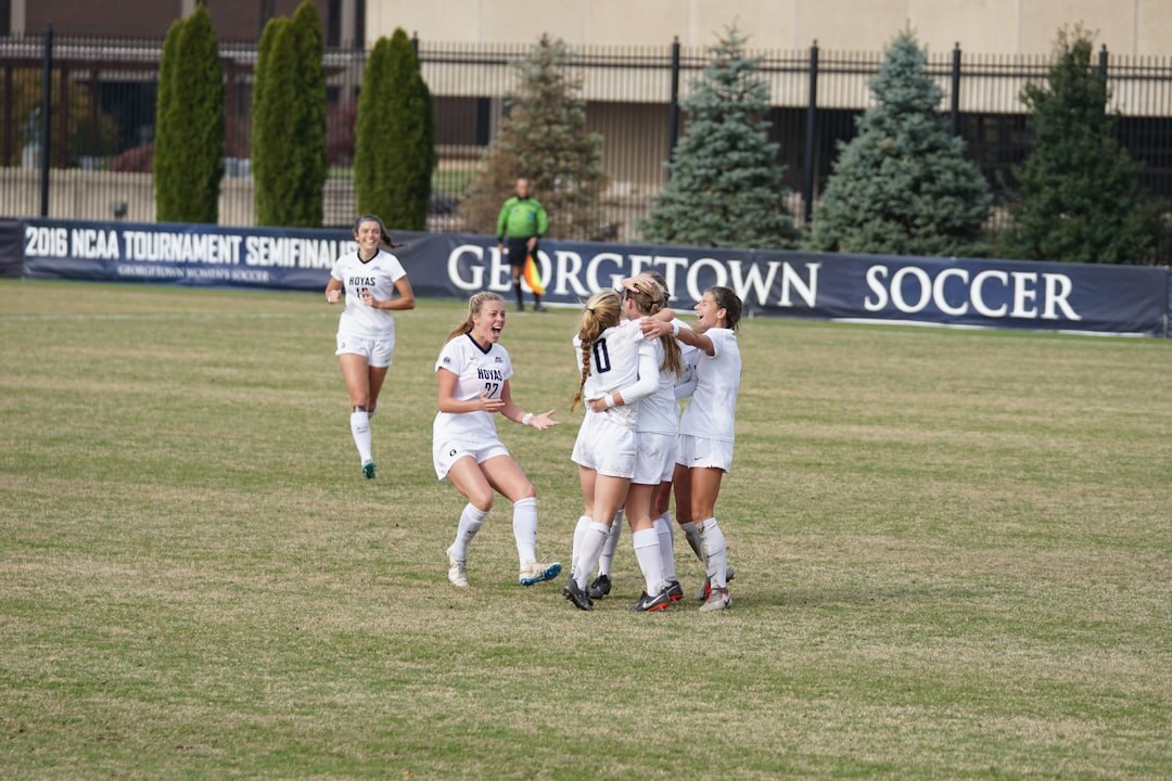 soccer players celebrating victory